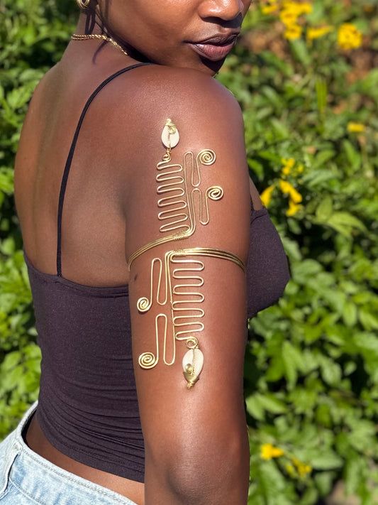 Ancestral Path – Stepped Cowrie Brass Arm Cuff