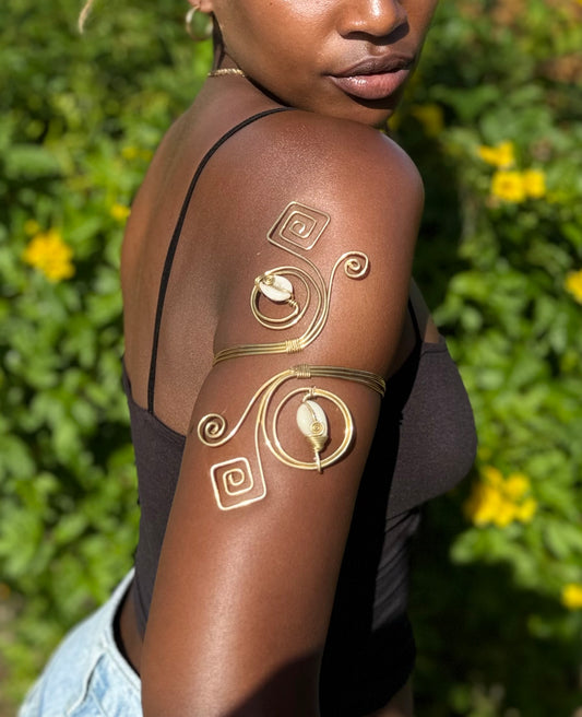 Golden Currents – Spiral Cowrie Brass Arm Cuff